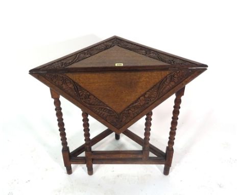 An 18th century style oak drop flap handkerchief table,on bobbin turned supports, 75cm wide x 72cm high and a George II style