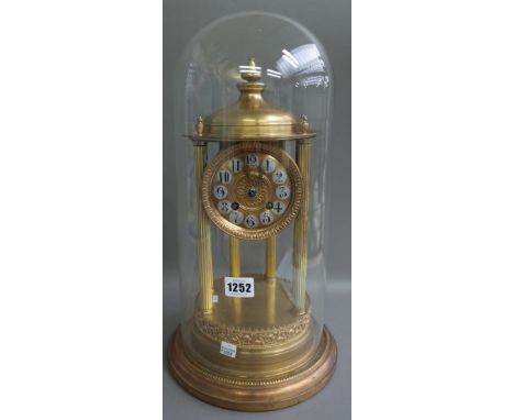A French gilt metal mantel clock, mid-20th century, the dial and movement housed under a domed and pillared cylindrical arbou