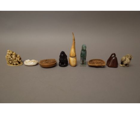 A group of carvings, mostly Chinese and Japanese, various dates, including; a small Chinese agate group of a monkey and and b