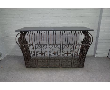 A French console table, the rectangular slate top over a bombe wrought iron base, 147cm wide x 85cm high. 