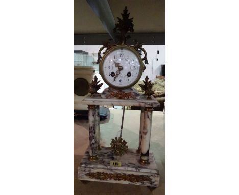 A French gilt metal mounted marble Portico mantel clock, late 19th /early 20th century, the drum case with foliate painted en