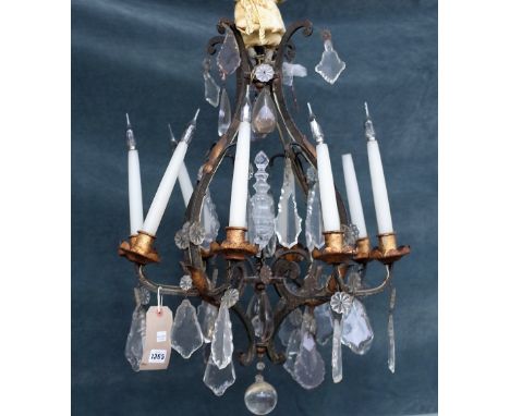 A wrought iron, gilt metal and glass mounted eight branch chandelier of open frame form hung with shaped glass drops, 65cm hi