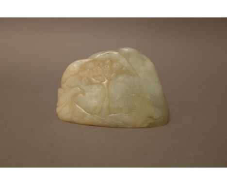 A Chinese pale celadon jade boulder carving, carved with a bird and animal beneath a pine tree, the reverse carved with a tre
