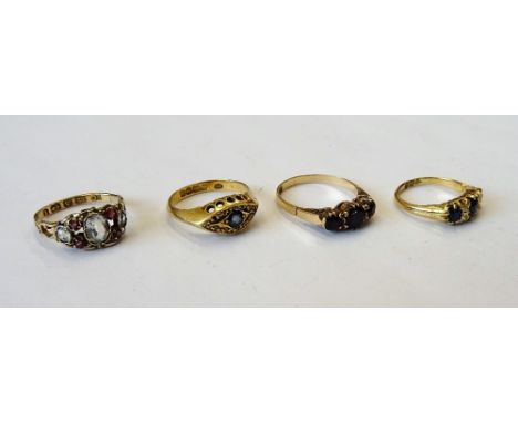 A Victorian 18ct gold, sapphire and diamond ring, mounted with three cushion shaped sapphires, alternating with two pairs of 