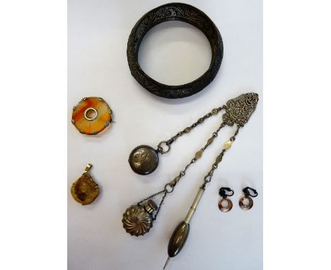 A Victorian agate brooch, of circular form, a native quartz pendant, a pair of costume earrings, an Eastern bangle and a Vict