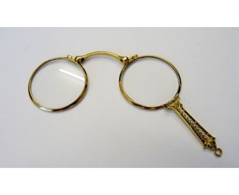 A pair of gold mounted folding sprung lorgnettes, fitted with circular lenses, the handle with engine turned and pierced deco