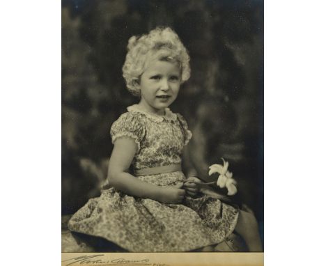 MARCUS ADAMS (1875 -1959)  Princess Anne on her fourth birthday, August 15th, 1954:   black and white photo. portrait shows h