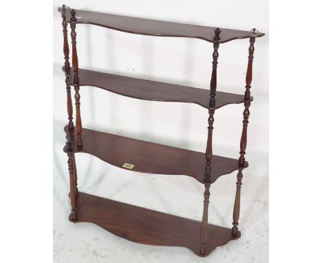 A Victorian rosewood serpentine hanging shelf, 66cm wide x 76cm high. 