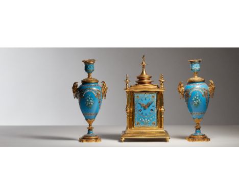 A French mantel clock garniture, C.1880, enamel on copper with jeweled and gilt decoration, with two train movement stamped L