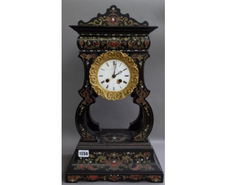 A French boulle work portico mantel clock, late 19th century, the white enamel dial detailed 'J. BRIGHT PARIS', the drum held