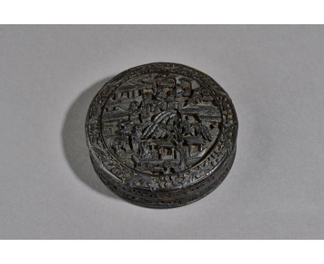 A Chinese export tortoiseshell circular snuff box and cover, 19th century,  the cover and underside of base finely carved wit