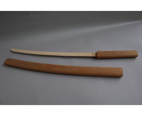 A Turkish sword Yataghan with engraved carved steel blade, 60cm, and two piece horn handle in a leather scabbard and a wooden