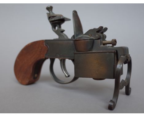 A Dunhill novelty 'Tinder Pistol' table lighter, 15cm wide.