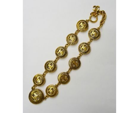 A Chanel gilt metal collar necklace, formed as a series of circular links, each pierced with the intertwined CC logo to the c