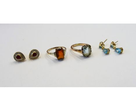 A pair of gold, ruby and diamond set, pear shaped cluster ear studs, the backs with post fittings, a pair of gold and blue to