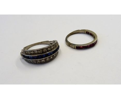A sapphire and diamond part eternity ring, mounted with a row of calibre cut sapphires to the centre, between two rows of cir