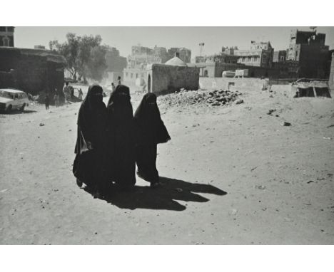 NICK ROSS  (Contemporary)  Three Middle Eastern Ladies in a cityscape, ca. 2008:  platinum print, 30cm x 45cm, unframed.  DDS