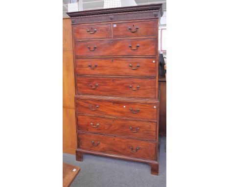 A George III mahogany chest on chest with two short over six long graduated drawers on bracket feet, 112cm wide x 196cm high.