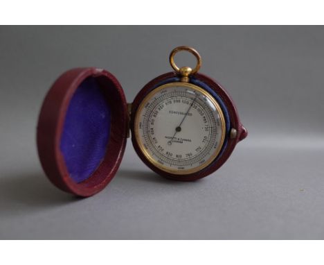 A brass cased compensated pocket barometer by Negretti and Zambra with leather case. 