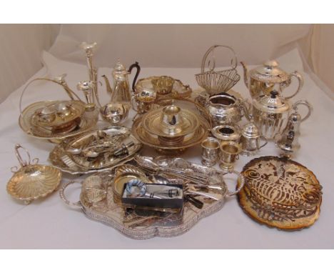 A quantity of silver plate to include trays, a tea set, an epergne, fruit dishes and condiments