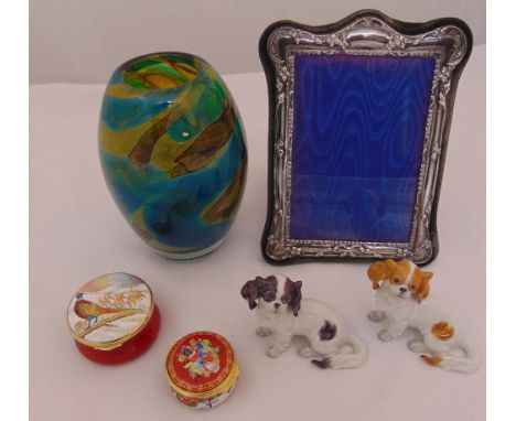 A quantity of collectables to include two figurines of dogs, a glass vase, two patch boxes and a photograph frame with silver