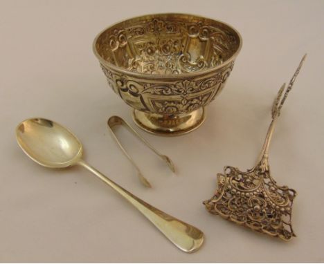 A silver hallmarked sugar bowl, Sheffield 1902, a pair of white metal cake servers a silver hallmarked spoon and a pair of si