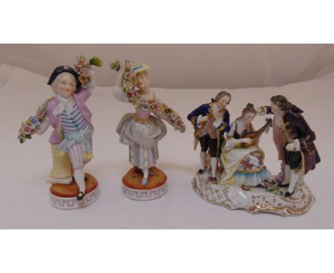 A pair of Sitzendorf porcelain figurines holding garlands and a continental porcelain figural group of musicians, tallest 14c