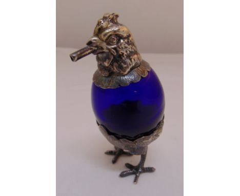 A continental white metal and blue glass cigar lamp in the form of a chicken with pull off head, 11cm (h)