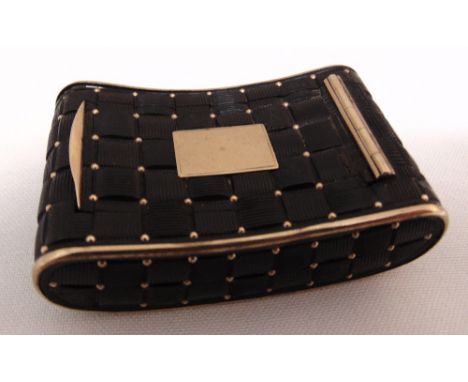 A 19th century shaped rectangular quilted tortoiseshell and gold snuff box, the hinged cover with vacant cartouche