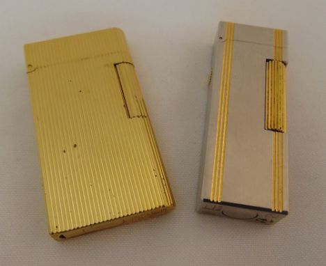 Caran D'Ache gold plated cigarette lighter and a Dunhill cigarette lighter