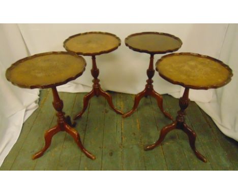 A set of four mahogany wine tables with Chippendale borders on three outswept legs, 57 x 37.5cm