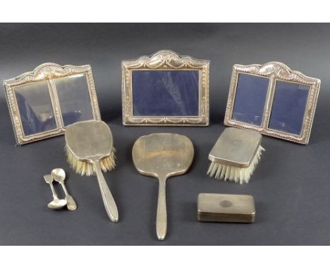 A collection of Victorian and later silver including a set of three silver photograph frames, all chased and embossed with sw