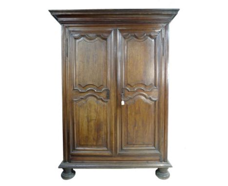 A French Louis XVI fruitwood armoire, late 18th century, cavetto moulded cornice over twin panelled doors enclosing a high sh