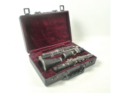 A 20th century student's clarinet by Blessing, in original hard carry case, 30 by 9 by 25cm.