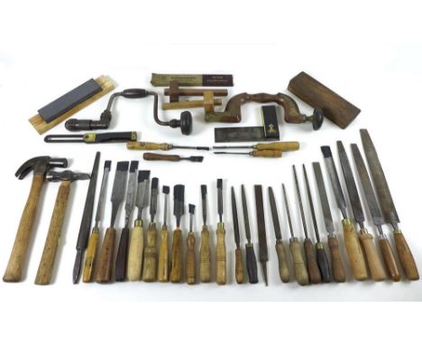 A group of woodworking tools, including a W Maples of Sheffield wooden brace with brass inlay, stamped by H Ewen, 36cm in len