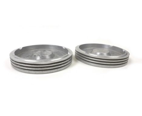 A pair of WWII Rolls Royce cylinder heads from a Merlin engine in a Spitfire, later turned into ash trays, both engraved with