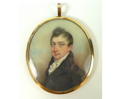 A Georgian portrait miniature of a young gentleman, painted on ivory, gilt metal frame, the back of the frame with bevelled b