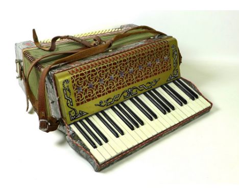 An Estrella Piano accordion with pearlised finish, 48 by 44 by 22cm, in fitted black carry case.