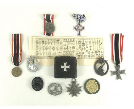 A group of WWII, Third Reich medals comprising a War Merit Cross, a Knight's War Merit Cross with swords, a War Merit Cross 2