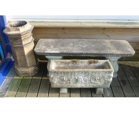 A Victorian buff terracotta octagonal chimney pot, 36 by 71cm, a reconstituted stone bench, 39 by 125 by 41.5cm high, and a r