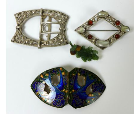 A group of buckles and brooches, comprising a silver gilt and enamel buckle designed with bluebirds soaring against a foliate