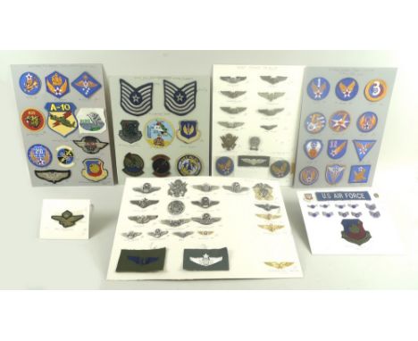 A collection of 20th century US military flying and associated cap and uniform badges for the US Air Force, Army Air Force, A