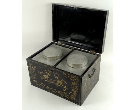 A large 19th century Chinese export black lacquered and gilt decorated tea caddy, pewter lined bi-compartmental interior with