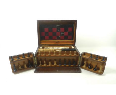 An Edwardian oak cased games compendium with hinged lid, folding front and two lift-out trays, possibly The Royal Cabinet of 