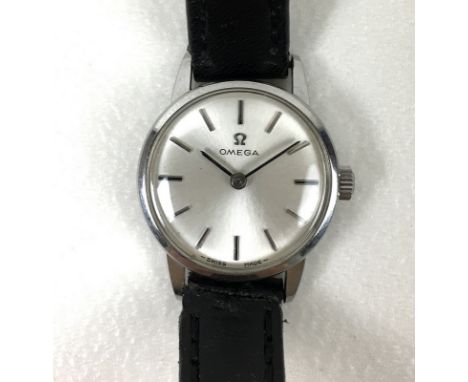 An Omega steel cased lady's wristwatch, circa 1970's, circular silvered dial, silver batons and arrow hands, manual wind, dia