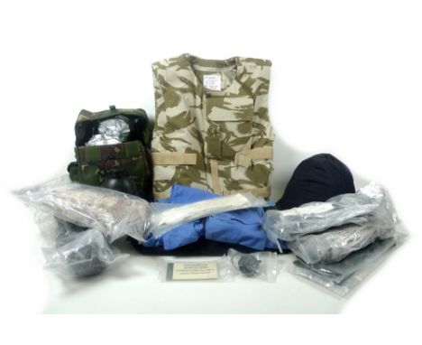 A selection of modern British army equipment including a body armour vest with two removable bulletproof plates, a helmet wit