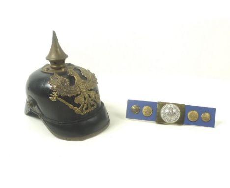 A WWI Prussian pickelhaube, the leather helmet with attached brass eagle emblem with motto Mit Gott Fur Koenig Und Vaterland,