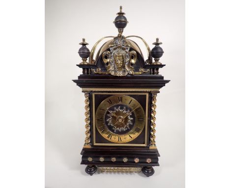 A 19th Century Continental Bracket Clock with square dial having brass chapter ring, twin train movement in ebonised case hav