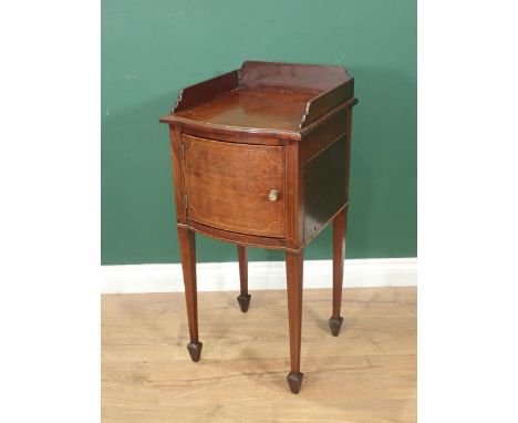 An Edwardian mahogany Bedside Stand bearing retailers label  "H&amp;S Jewell", Holborn bowfronted with single door on squared