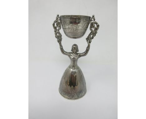 A George V silver Wager Cup in the form of a woman supporting swivel cup, London 1910 maker: F.H. &amp; S. Ltd, 6½in 